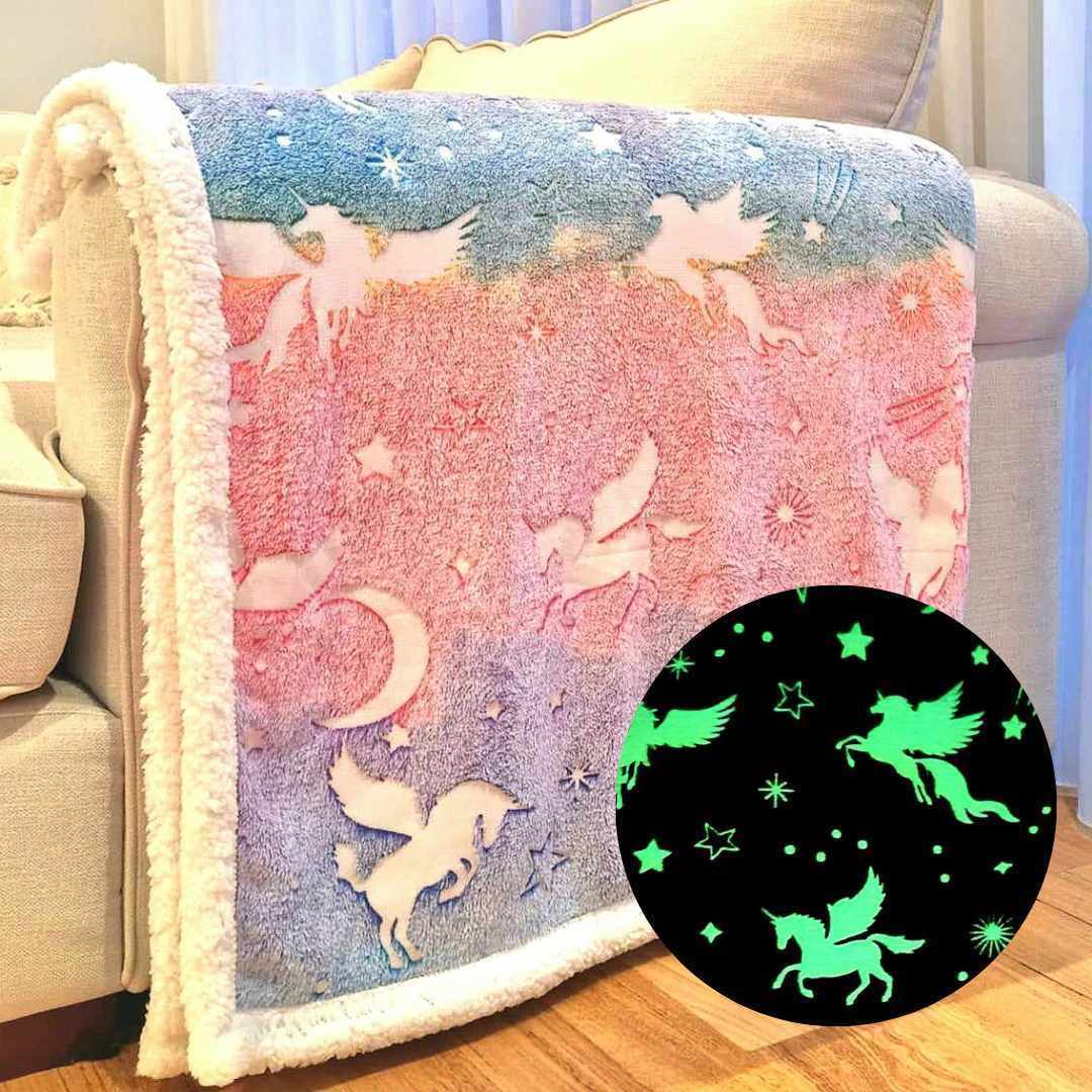 unicorn blanket draped over a couch